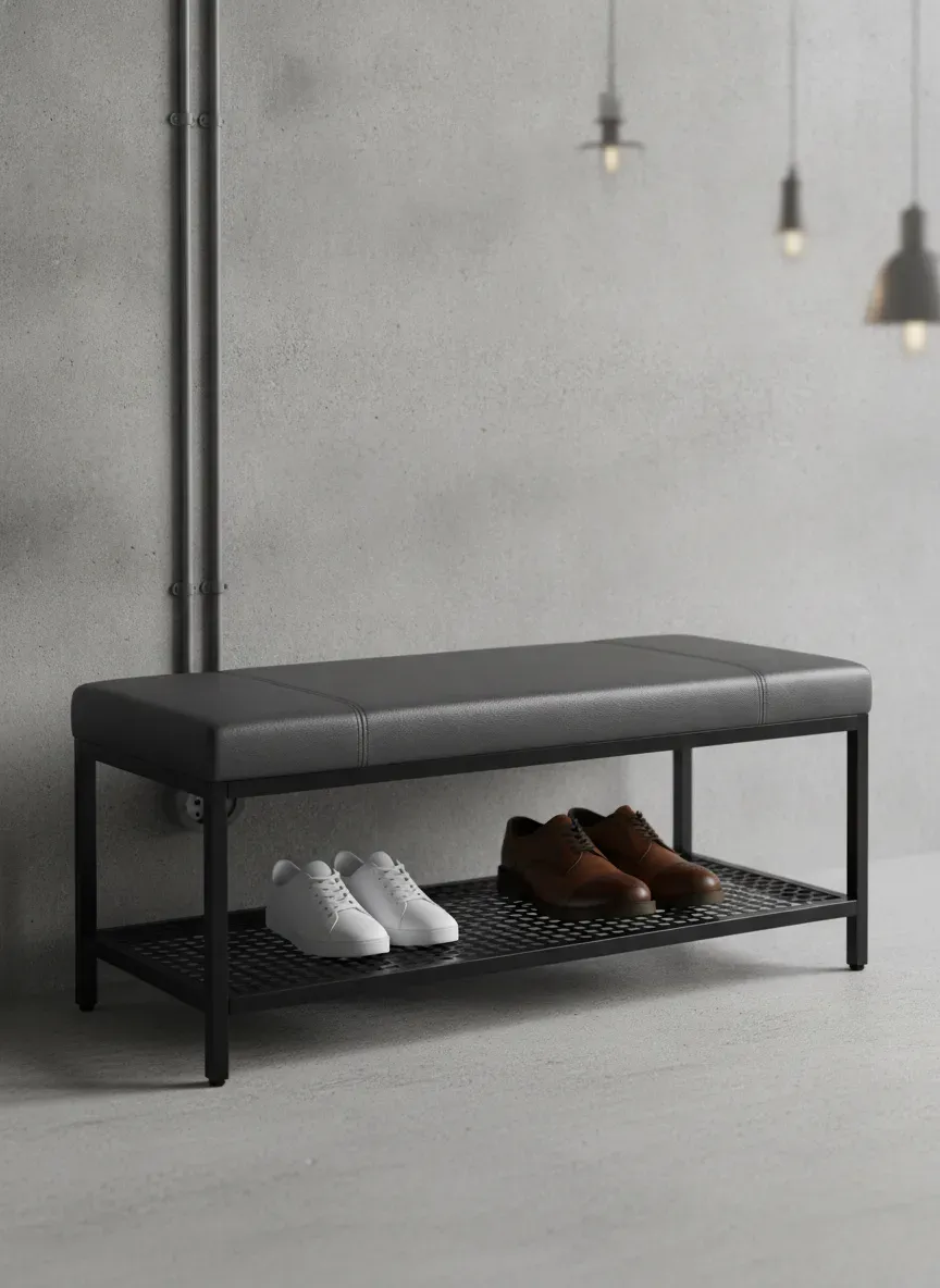 A sleek industrial storage bench with a faux leather top and metal mesh shoe shelf